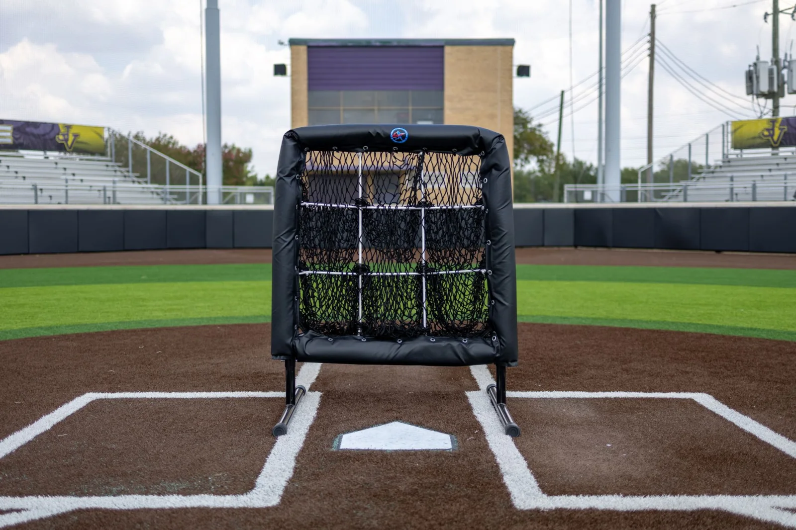 Padded pitching target screen framed square on home plate