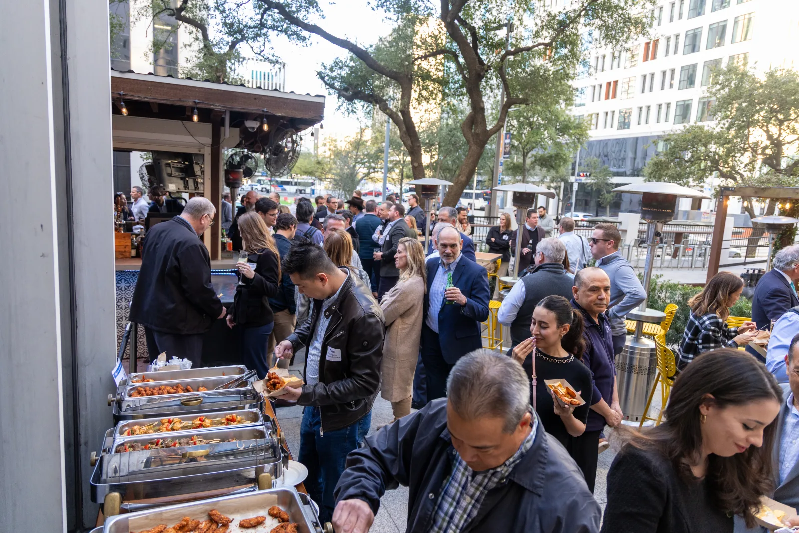 Guests moving through the catering line at an NPECA reception