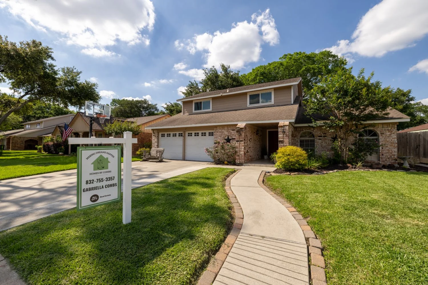 Houston-area listing exterior with agent signage on a clear day