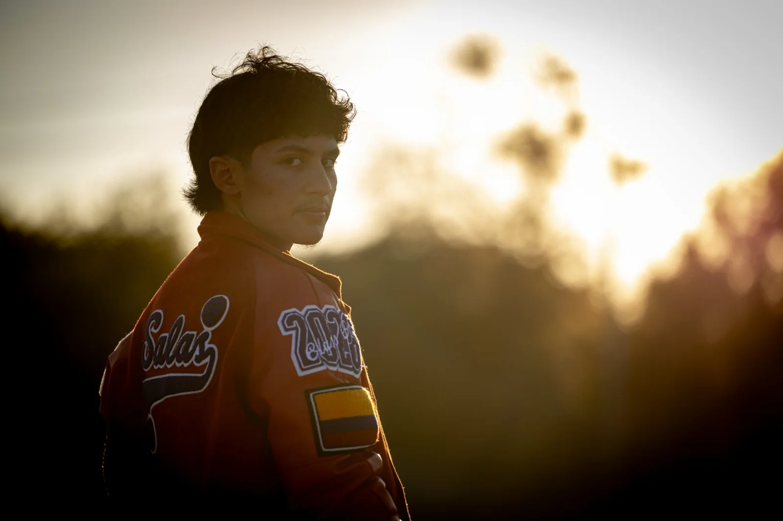 Senior backlit against the sun at golden hour